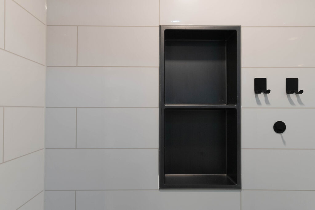 shower makeover with black niche shower storage 2024 shower trends fairfield tile pattern