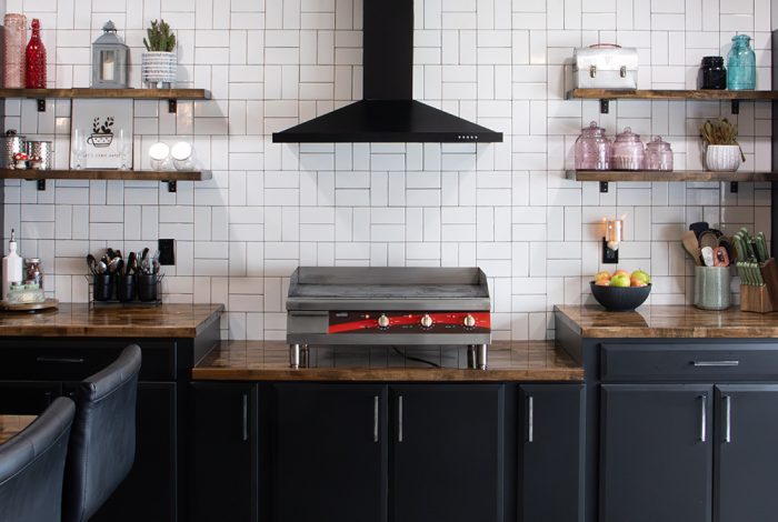 black kitchen cabinets with a modern farmhouse aesthetic